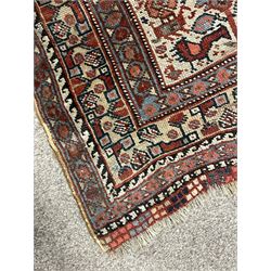 Persian rug, blue ground field decorated with quadruple pole medallion surrounded by animal motifs and stylised flower heads, multiple band border