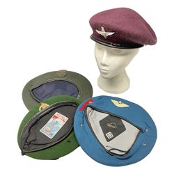 Four paratrooper berets - Russian, Italian, British and Foreign Legion; all with badges (4)