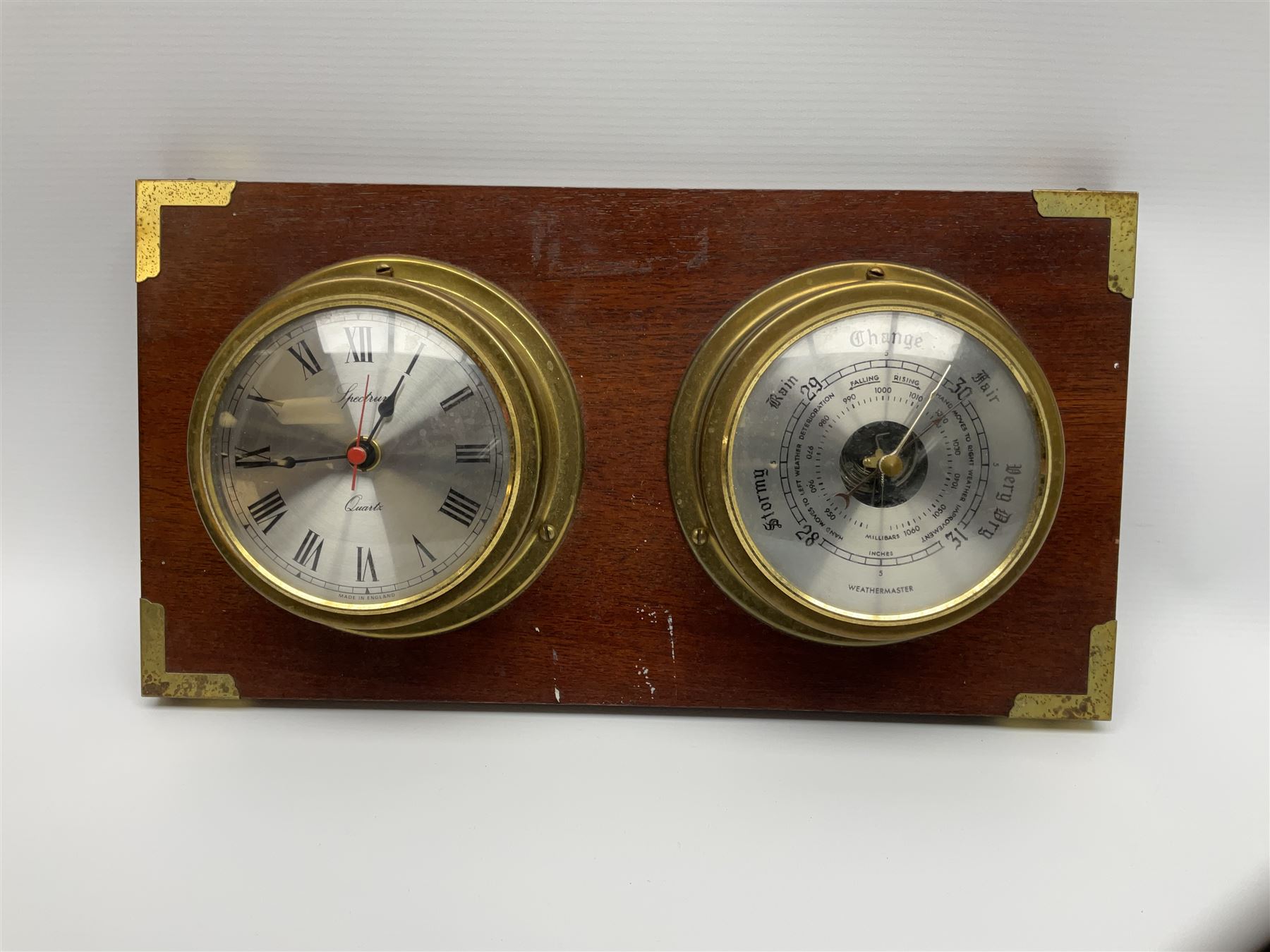 Wall hanging Spectrum quartz clock and Weathermaster barometer, together with six turned spokes ship wheel with brass central boss, D48cm