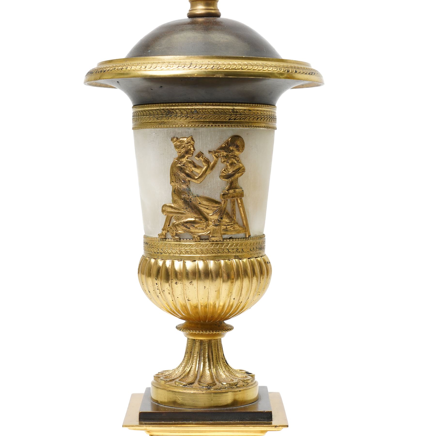 Pair of early 20th-century Neoclassical lamp bases in gilt bronze and alabaster, each decorated with classical figural reliefs celebrating the arts, each of baluster form, the alabaster bodies applied with finely cast gilt-bronze scenes including a seated painter at an easel, a sculptor at work, and allegorical female figures with musical  and theatrical motifs, mounted on square alabaster plinths with gilt-bronze borders and raised on bun feet, the domed shoulders enriched with laurel-leaf mouldings, H42cm 