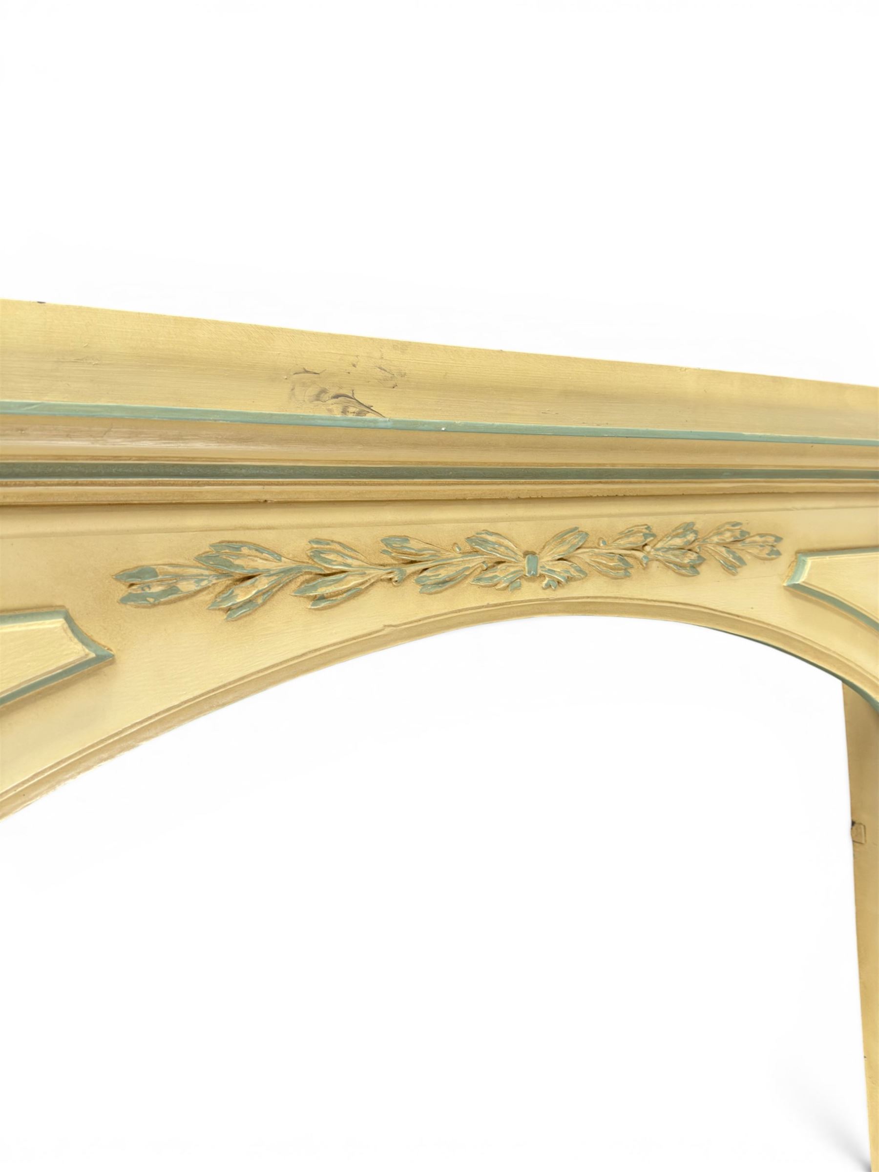 Two large painted pine window or door surrounds, square cornice with arch top, applied mouldings (widths 180cm and 130cm)