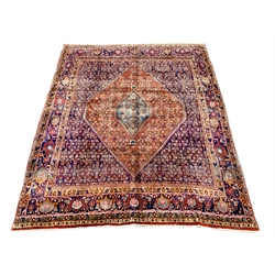 Fine Persian Bijar rug carpet, red ground lozenge with inner central lozenge on dark blue field, profusely decorated with herati and stylised motifs, repeating guarded border, 294cm x 235cm