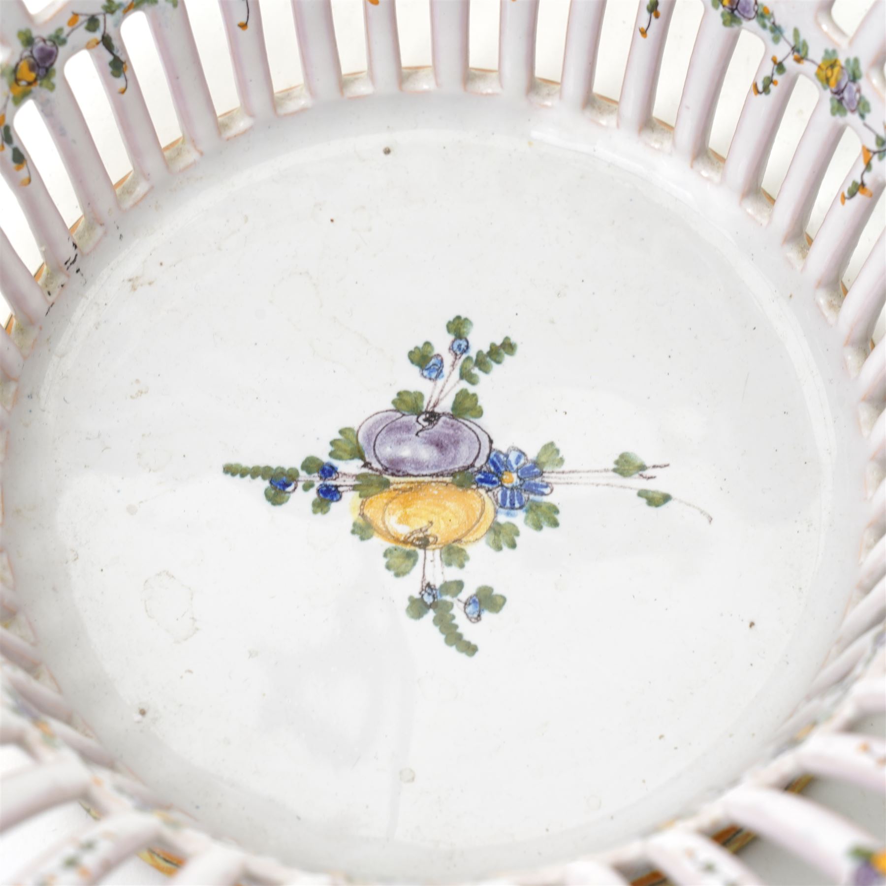 Two 20th century French faience openwork baskets, by Emile Tessier Malicorne, painted with polychromatic floral decoration, with scalloped rims, marked to base, larger 9cm (2)