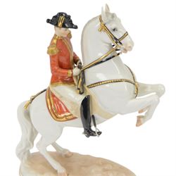 Royal Vienna Augarten figurine, modelled a Spanish Riding School rider upon rearing horse, with Trab-Spanische Reitschule Hofburg Wien in gilt to the base, H30cm