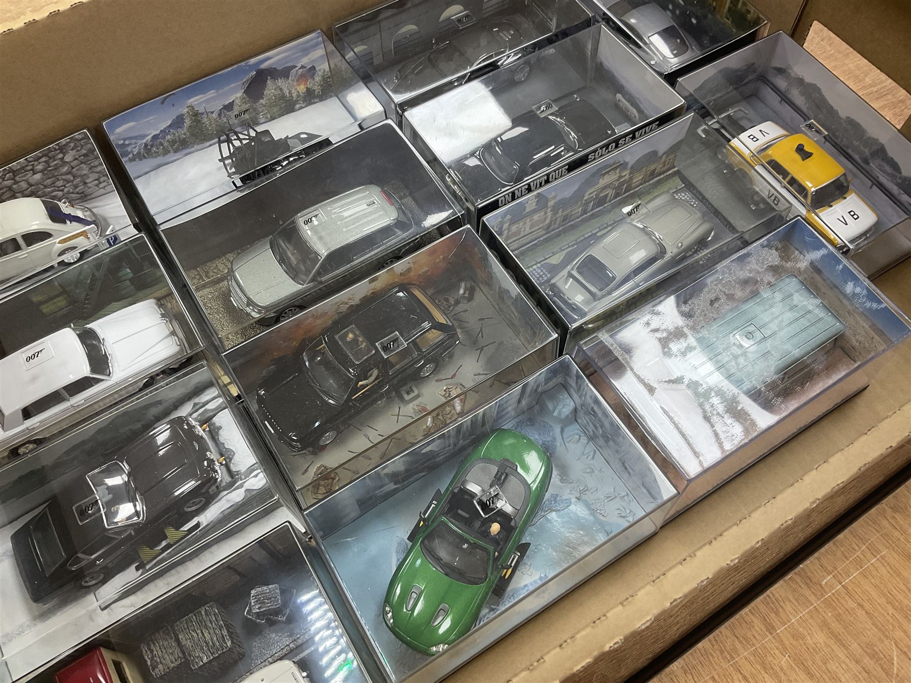 Fabbri James Bond Collection - over one hundred and ten die-cast models in perspex display cases as issued periodically; and a quantity of associated magazines and trading cards, in five boxes