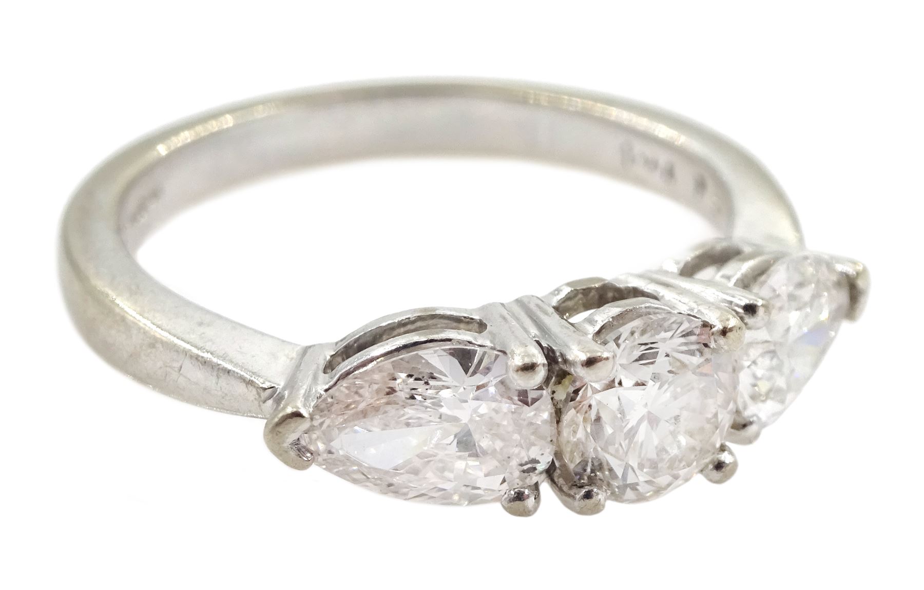 18ct white gold three stone diamond ring, central round brilliant cut diamond with two pear shaped diamonds either side, hallmarked, total diamond weight 1.48 carat