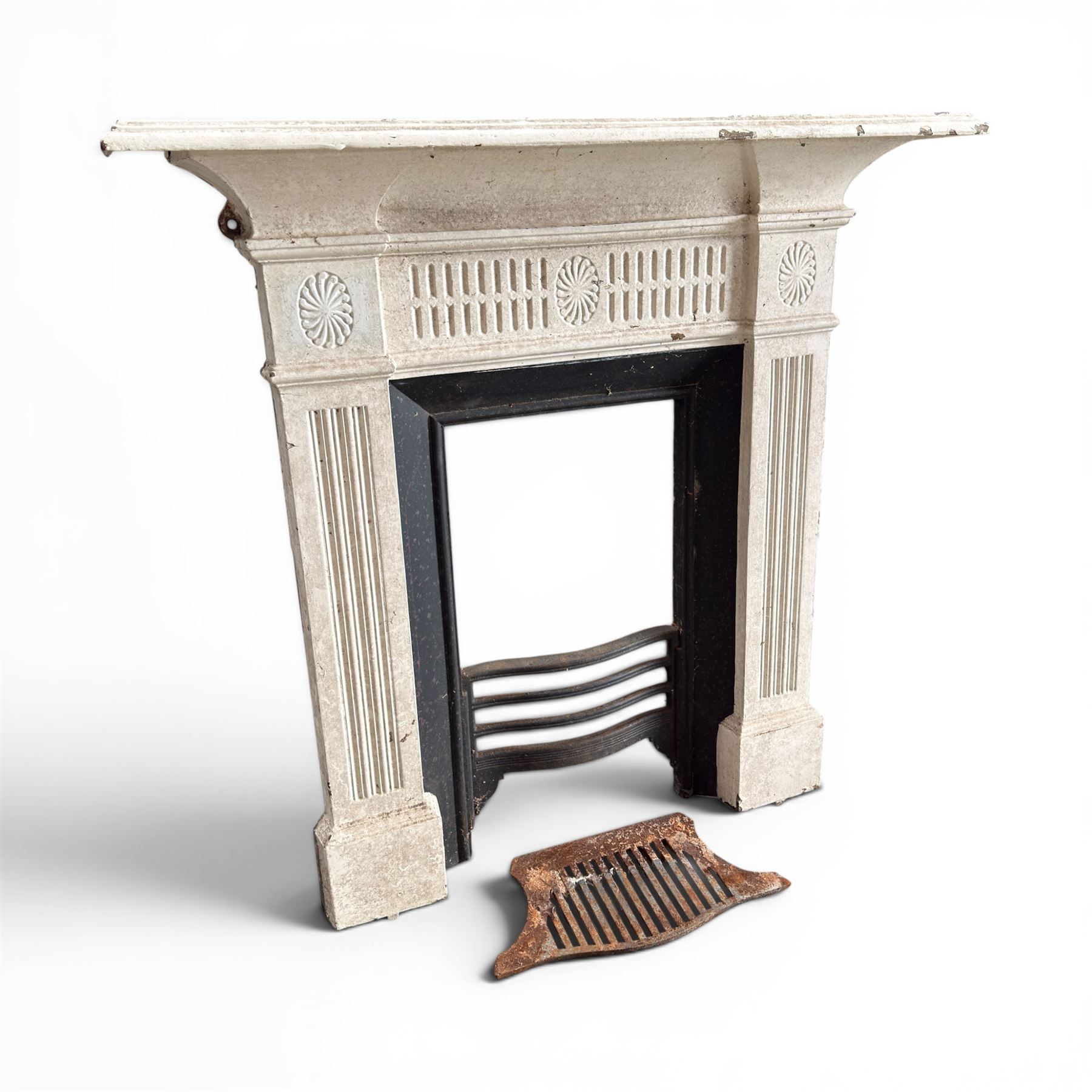 19th century Neoclassical design cast iron bedroom fire surround with fluted and rosette design, white painted finish with  black slip