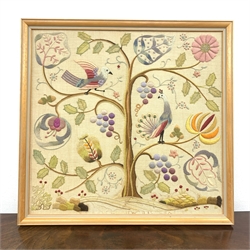 A mid/late 20th century framed needlework picture, depicting birds upon a blossoming tree, H48cm L50cm.