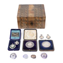 Group of early 20th century sporting medallions, fobs and badges, including two silver Int...