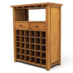 Traditional design light oak wine server, rectangular overhanging top above an open undertier with grooves for wine glasses, fitted with two drawers, lower section with open bottle racks for thirty five bottles, raised on square supports