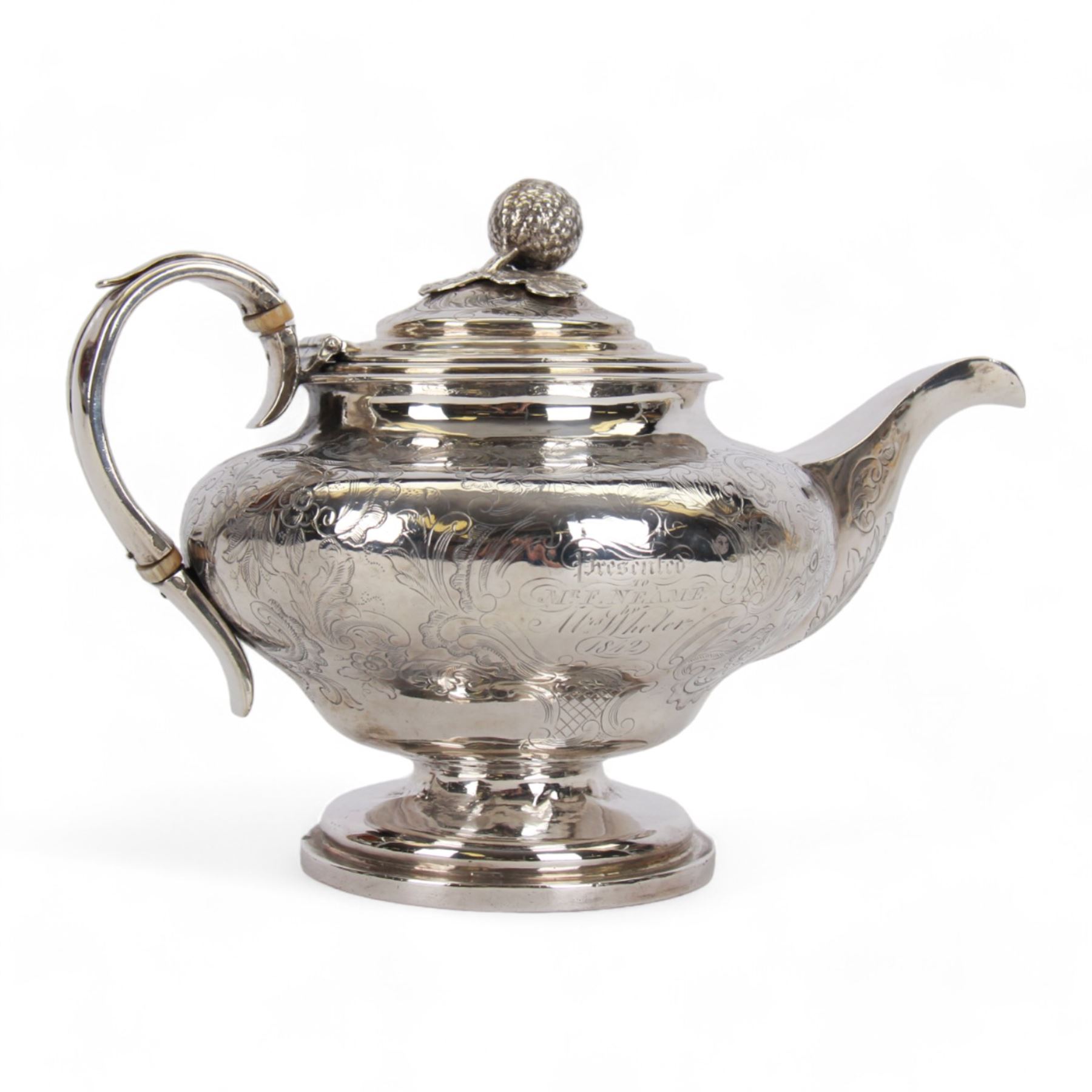 Victorian silver teapot, the body of bulbous form engraved with named cartouche and surrounded by flower heads and foliate scrolls, with capped strap handle with ivory insulator, and melon foliage mounted finial to the hinged lid, upon a circular stepped foot, hallmarked Francis David Dexter, London 1841, H17cm

This item has been registered for sale under Section 10 of the APHA Ivory Act