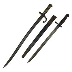 WWI Remington Pattern 1913 bayonet, the 43cm fullered blade with various marks to the ricasso including date code 11 16; in leather covered scabbard with various stamps including JWB 17 L58cm overall; and a French Model 1866 sabre bayonet (no scabbard)