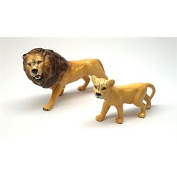 Two Beswick figures, lion, L23cm, H14cm, and cub, L17cm H10cm, each with printed mark beneath. 