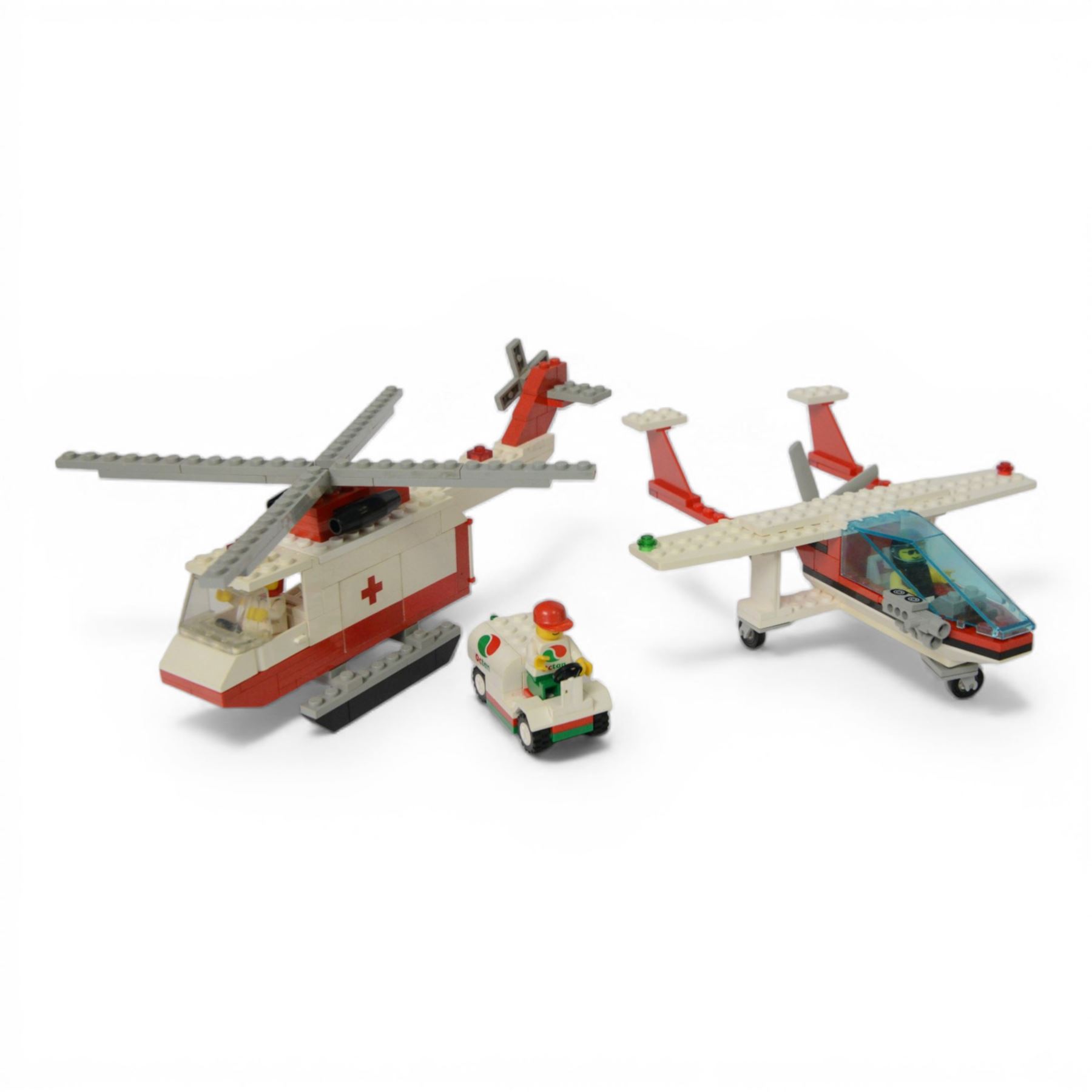 Eight vintage Lego Classic Town vehicles, comprising no. 6853 Coastal Cutter, no. 6359 Horse Trailer, no. 6693 Recycle Truck, no. 6361 Mobile Crane, no. 6340 Hook and Ladder, no. 6691 Red Cross Helicopter, no. 6341 Gas 'n' Go Flyer and no. 6697 Rescue Helicopter, all built with minifigures