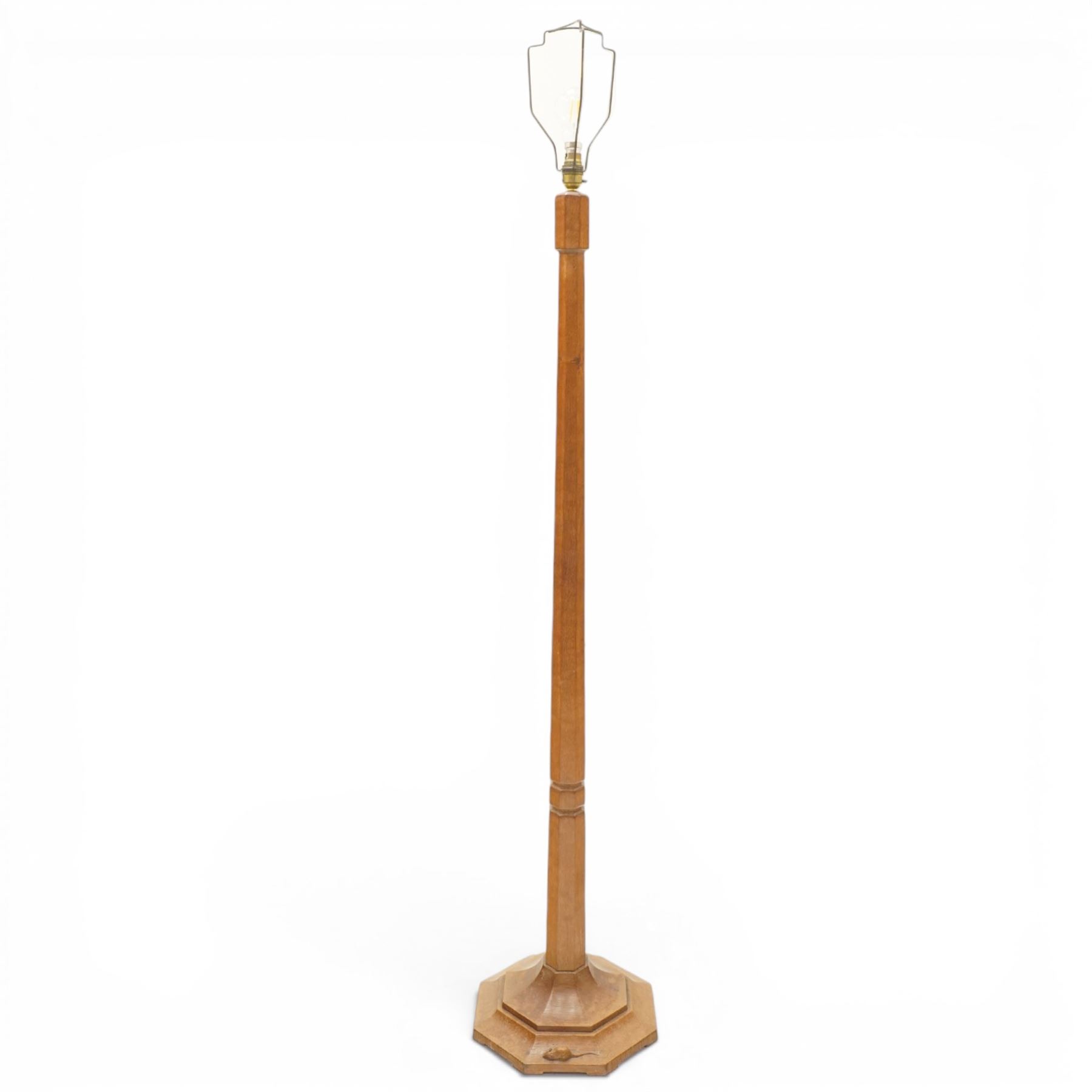 Mouseman - mid-20th century oak standard lamp, octagonal turned column, with faceted stepped base, with carved mouse signature, by the workshop of Robert Thompson of Kilburn