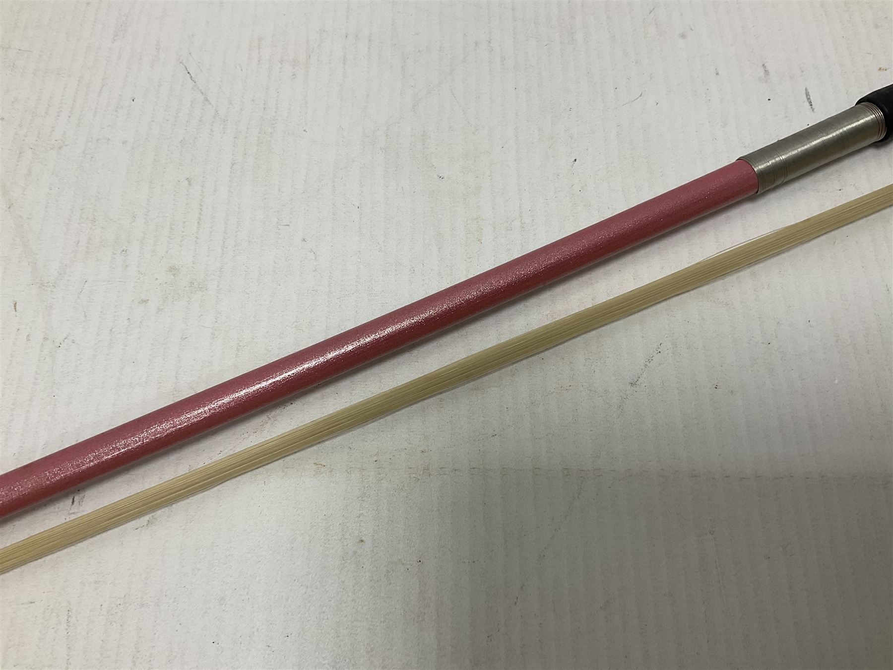 Zest full size pink violin, with a solid wood body and maple head, with matching pink bow and two further bows, in a hard case Length 60cm