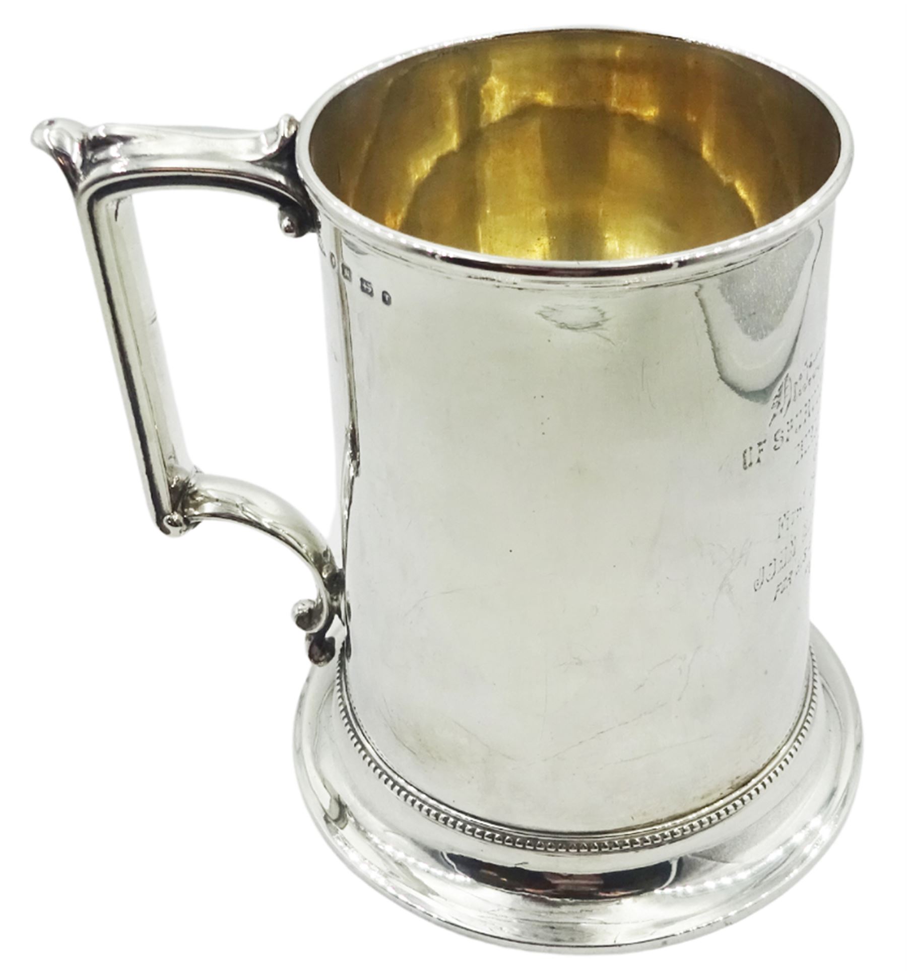 Victorian silver tankard of slightly tapering cylindrical form with engraved dedication to body, and angular scroll handle, upon a flared foot with beaded border, hallmarked Birmingham 1868, H14cm, approximate weight 13.76 ozt (428.2 grams)
