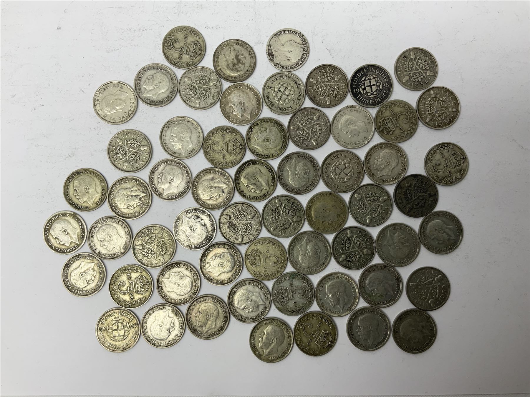 Approximately 90 grams of Great British pre 1920 and approximately 80 grams of pre 1947 silver threepence coin
