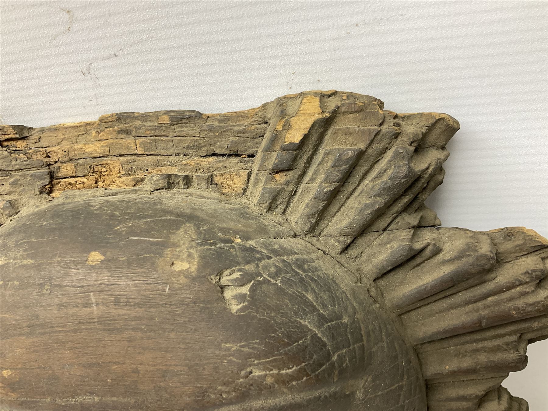 Carved pine mask of the sun, probably late 17th/early 18th century, originally a cresting, bearing Christie's lot labels, D20cm

Provenance 
Lot 161, Christopher Howe - The First Twenty Years, Christie's. 24th March 2004
