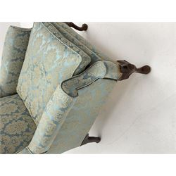 Late 20th century Queen Anne style walnut wingback armchair, on shell carved cabriole feet, sprung seat with seat cushion, upholstered in blue Damask fabric