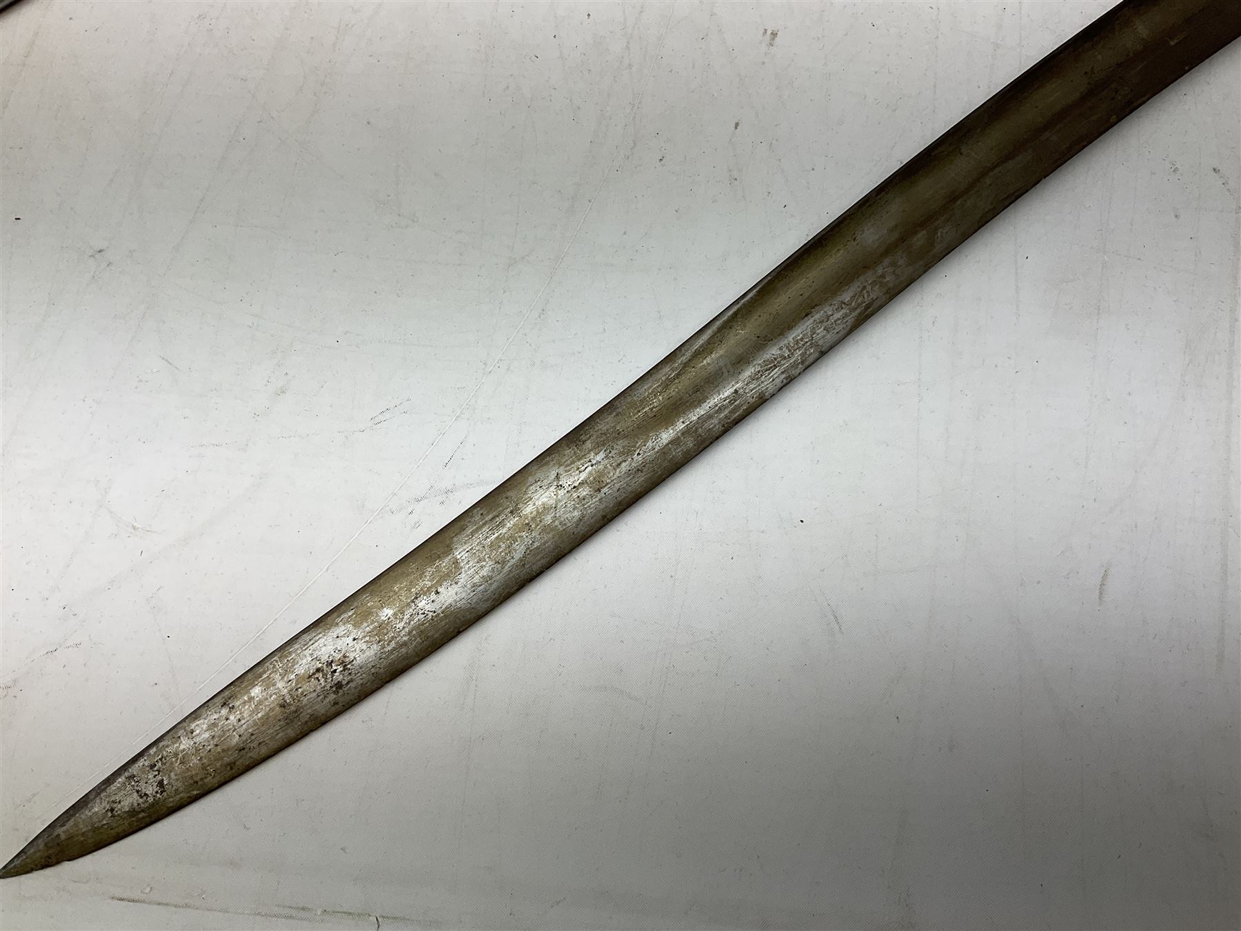 French Model 1866 sabre bayonet with 57cm fullered steel curving blade; in steel scabbard L71cm overall; another Model 1866 sabre bayonet lacking scabbard; and British Pattern 1856 sword bayonet (no scabbard) (3)