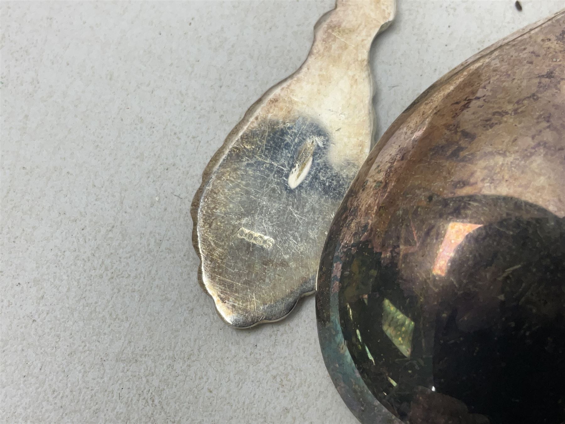 Set of four Continental silver spoons and forks, with stylised terminals, a number stamped S800, approximate weight 88.4 grams