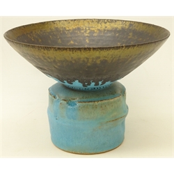  Studio pottery footed vase decorated with turquoise and bronzed manganese rim, on large cylindrical base, in the style of Lucie Rie, with impressed mark, H15cm x D21cm   Provenance: from the estate of Keith Beverley of Sandell, Flamborough  
