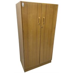 E. Gomme for G-Plan - 'Brandon' light oak double wardrobe, the interior fitted with hanging rail and shelves 