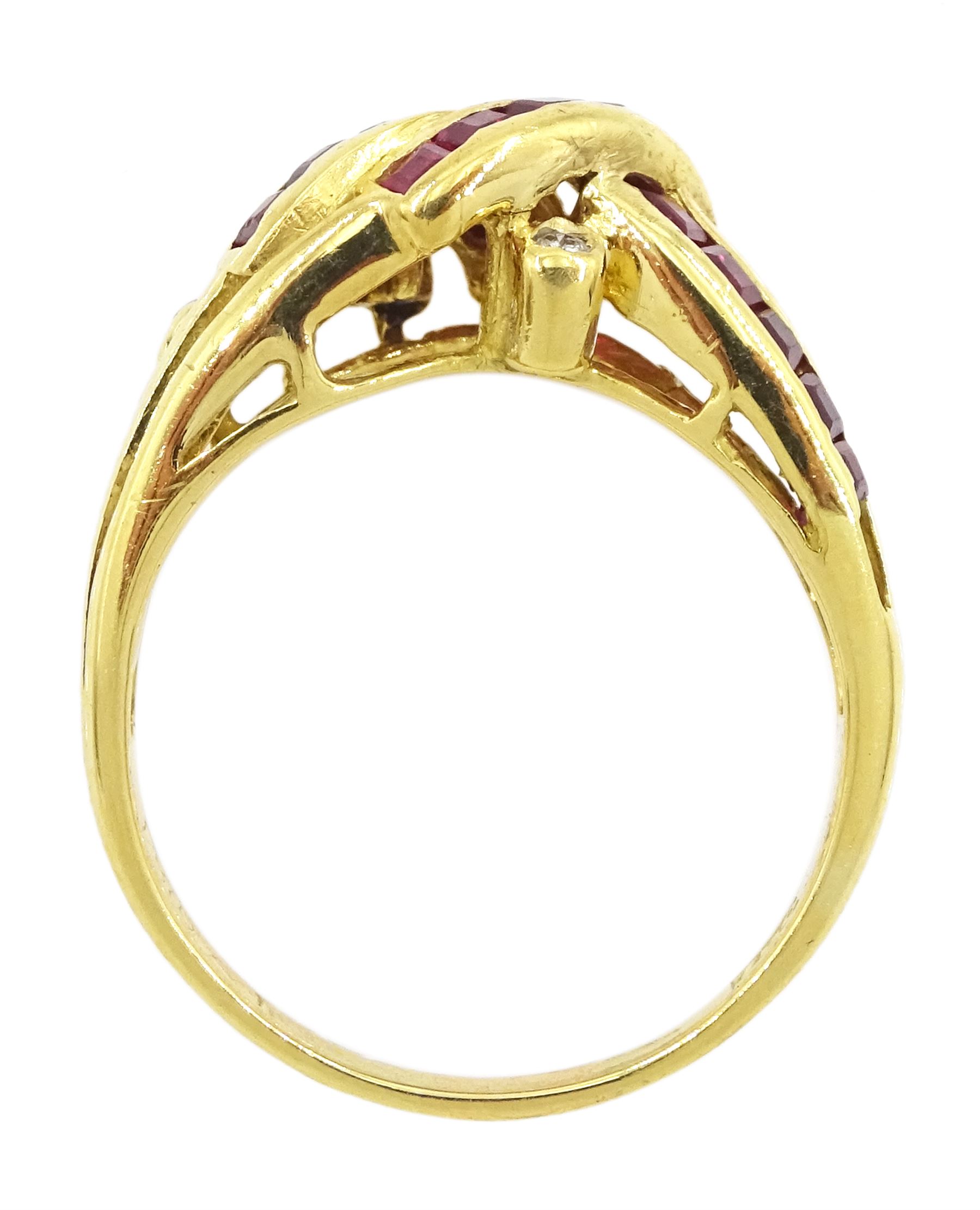 18ct gold channel set, calibre cut ruby and round brilliant cut diamond crossover ring, stamped 750