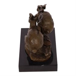 Bronze figure group, modelled two hares in chase, upon naturalistically modelled oval base signed Nick and with foundry mark, raised upon black marble base, H11cm L12.5cm