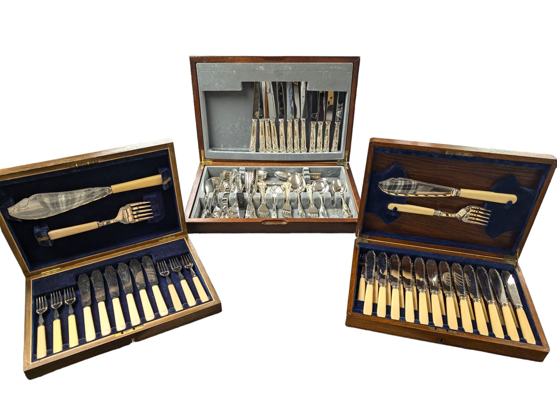 Three cased canteens of cutlery, including King's pattern set and two ivorine handled sets