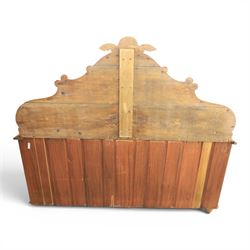 Victorian pine chiffonier, shaped moulded top with raised scroll carved back surmounted by carved fruit and foliate crest, fitted with two frieze drawers over two panelled cupboard doors, the outer cupboards of bowed form, carved foliate corbels, on plinth base