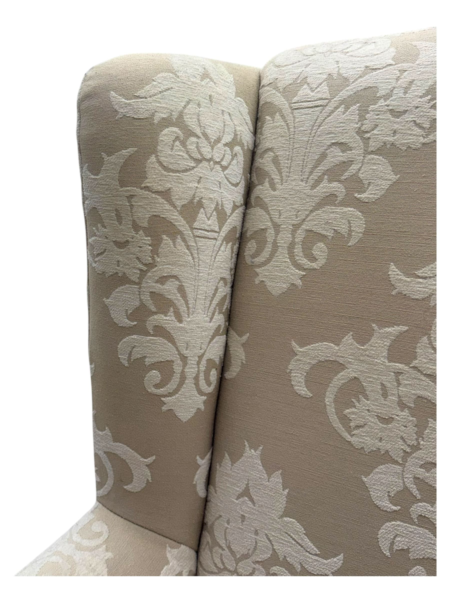 Chatsworth hardwood-framed armchair upholstered in cream  damask, with rolled arms and cushioned seat, raised on square tapered feet