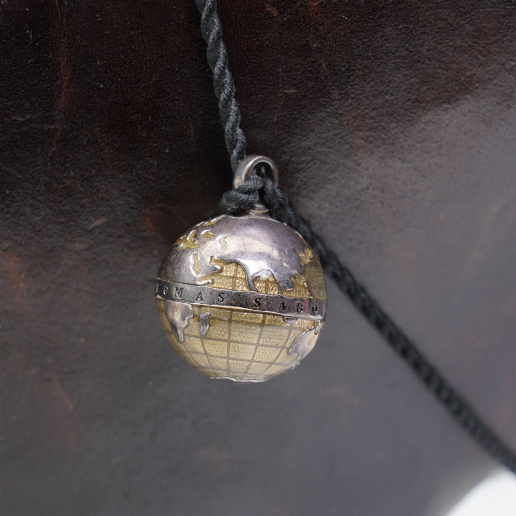 Omersa leather footstool in the form of hippopotamus, with silver 'The World of Thomas Sabo' charm collar, with original retail card tag, W80cm 