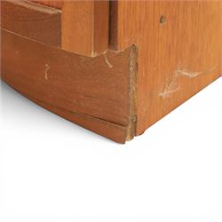 Nathan - teak corner cabinet, the upper section with moulded cornice and two fixed shaped open shelves, above a curved corner cupboard with twin signature square panelled doors, on a shaped plinth
