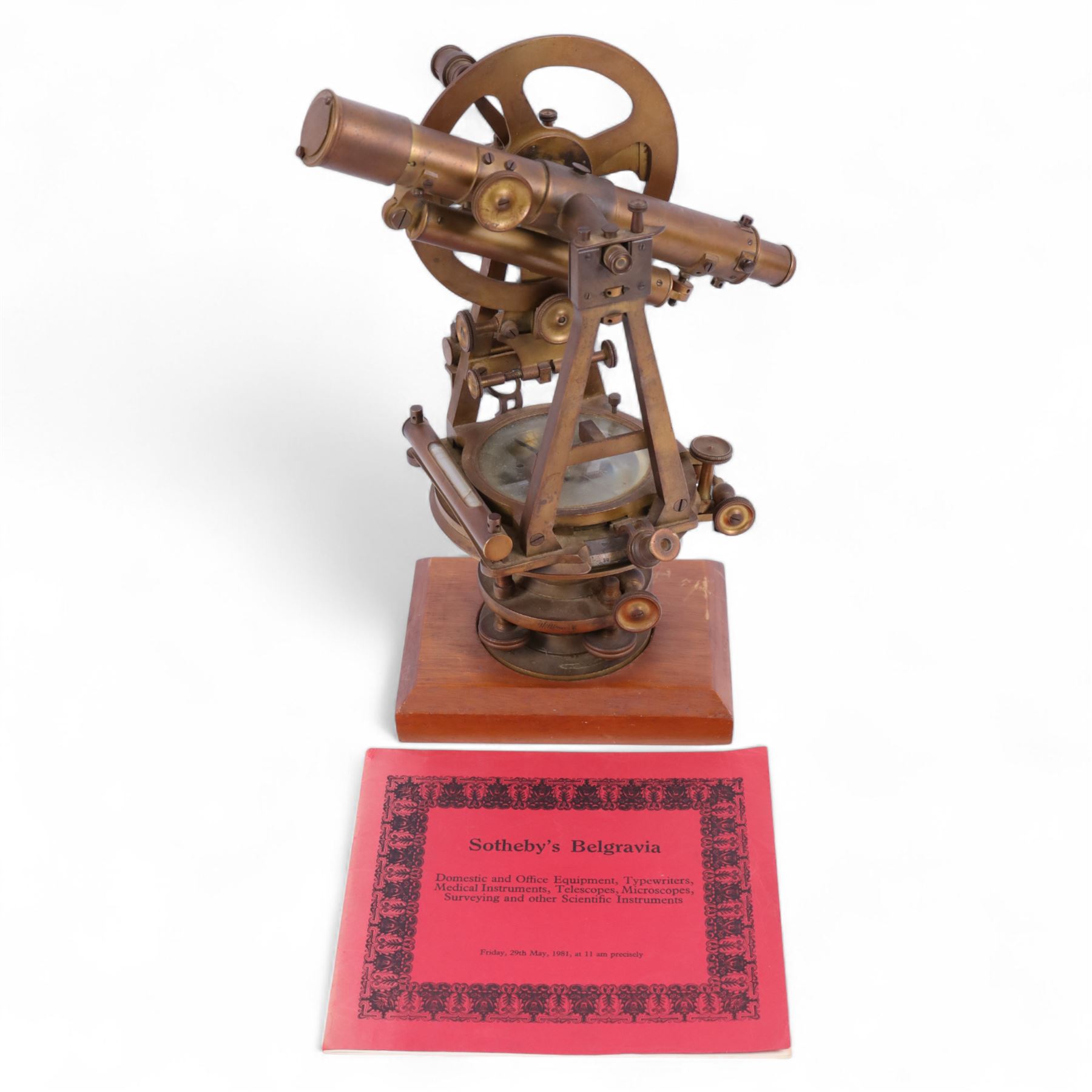 19th Century brass transit theodolite by Troughton & Simms, the sighting telescope with rack and pinion focusing above an inset compass, upon four levelling feet and a rectangular wooden base, including base H35.5cm