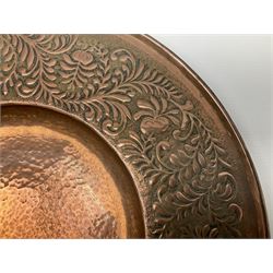Arts and Crafts Keswick School of Industrial Arts copper charger, decorated with planished centre and repousse scrolling foliate tendrils to rim, D44cm