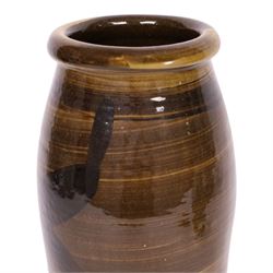 Studio pottery vase by Menston Art Pottery, decorated with brown and green slipware design, H39cm