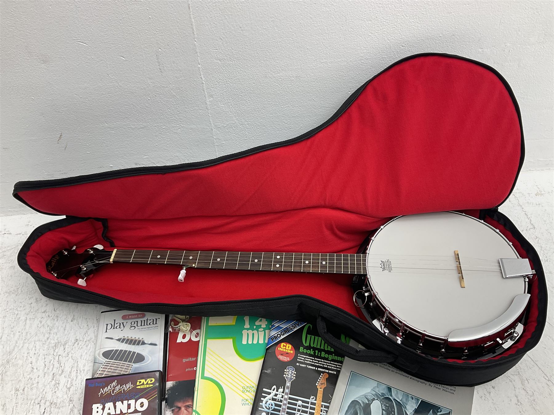 Rally five-string banjo with mahogany solid back L101cm in soft carrying case; and Brunswick Model BF200 acoustic guitar L103cm; with small quantity of instructional DVDs and booklets