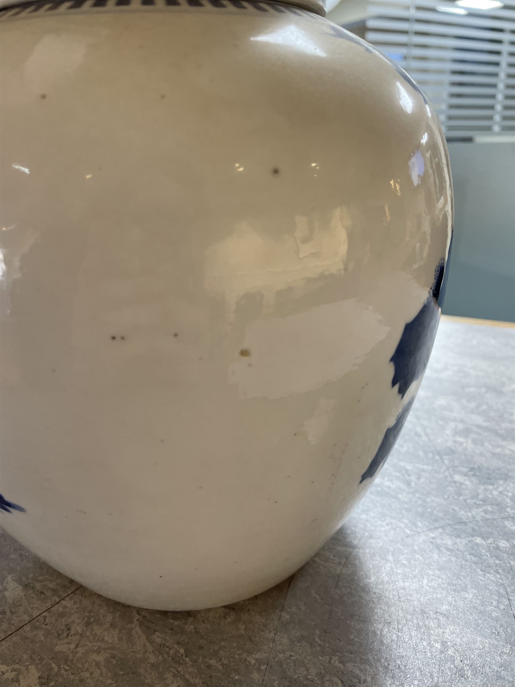 Late 19th century Chinese blue and white ginger jar, of ovoid form with flat topped circular cover, the body decorated with a geisha on reindeer with attendant in a landscape setting, with apocryphal Kangxi mark beneath, H24cm