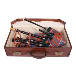 Set of ebonised wooden bagpipes, with new bag in Cameron of Lochiel tartan, contained in l...