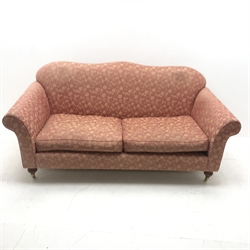 Wesley Barrell Hinton two seat sofa, shaped cresting rail, scrolling arms, turned supports on castors, W200cm