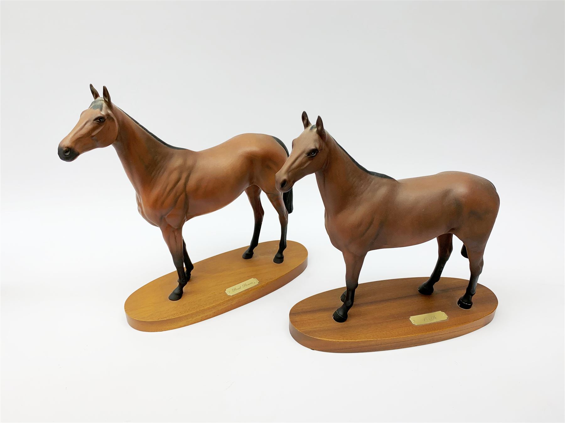 Four Royal Doulton horse figurines, comprising Red Rum, Arkle, and the Winner DA154, and another modelled as a prancing bay horse, largest H32cm. (4). 