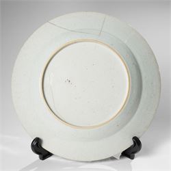 Three Chinese Kangxi period blue and white plates, painted in underglaze blue with various patterns, including Butterfly and Rockery, Pagoda and River Landscape, and floral sprays, each approx. D23cm (3)