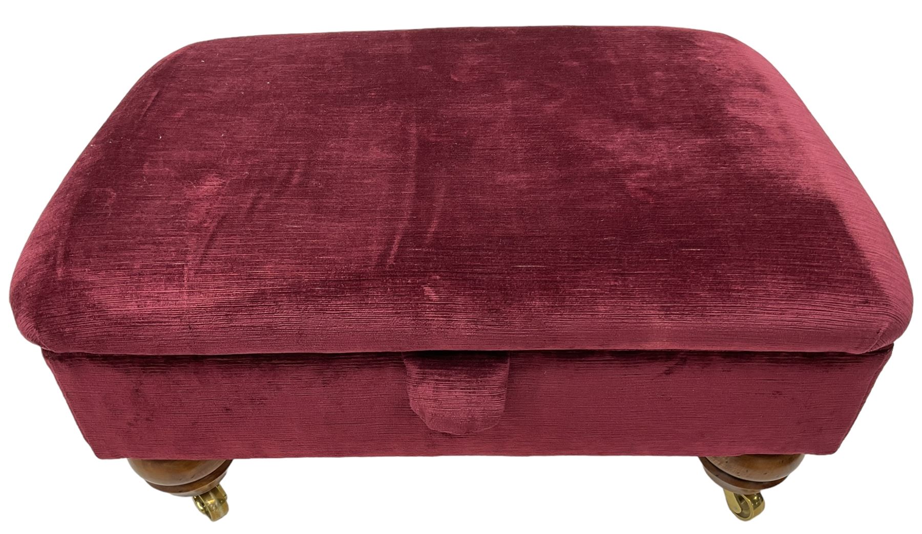 Duresta - traditional shape armchair upholstered in burgundy red velvet, on square tapering front supports (W88cm, H85cm, D103cm); together with a matching rectangular footstool with hinged seat, on turned feet with brass castors (73cm x 54cm, H38cm)