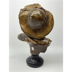 19th century plaster bust of a young boy wearing a hat on black painted socle base, H49cm 