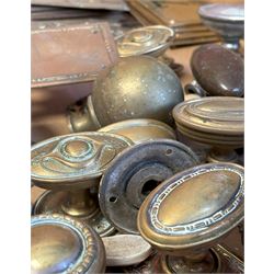 Collection of mainly early 20th century door furniture, to include Art Nouveau brass finger plates, brass door pulls and knobs, ceramic escutcheons and latches, together with other antique hardware. (some later)  - COLLECTION BY APPOINTMENT FROM: The White House, Thirsk Road, Easingwold, York, YO61 3NF - CALL 01723 507111 TO ARRANGE