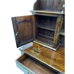 Traditional oak dresser, the moulded cornice over shaped apron, three heights plate rack fitted with two cupboards, the base fitted with six drawers and two double cupboards, panelled pointed ogee arched doors, on bracket feet