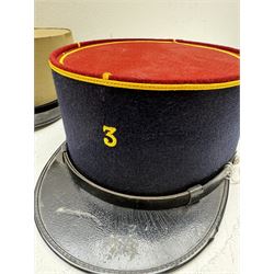 Three French Foreign Legion Kepis; two infantry examples and the third Calvary, each with black peak, original leather sweatband and markers mark stamped inside 