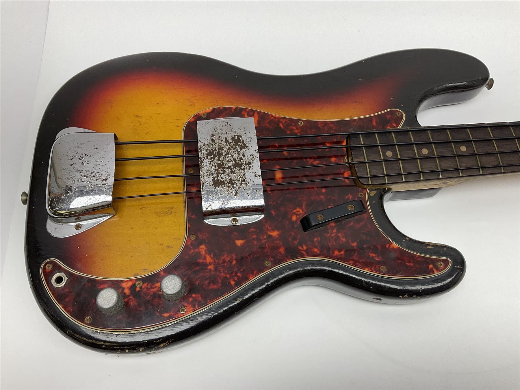 Early 1960s American Fender Precision electric bass guitar with original three-tone sunburst finish and faux tortoiseshell scratch plate; rosewood fretboard; all original fittings including chromium plated bridge and pick-up covers, finger rest, 'pots' and machines, dated on end of neck 5NOV62C, serial no.91625; L115cm overall; in Selmer simulated reptile skin covered carrying case. Sold with non-transferrable CITES A10 licence, certificate no.23GBA10CNKKEB, serial no.441200, dated 30th August 2023. Also included are original 1960s photographs of the band 'The Rascals' and photocopies of newspaper cuttings advertising their forthcoming performances along with a photocopy of a photograph of their television appearance on 'Opportunity Knocks' in 1967/8 (coming second to Mary Hopkins). In addition there is a reel-to-reel tape recording and USB stick of the band playing and two sheets of biographical information. Auctioneer's Note: The guitar was ordered by Trevor Parker from Pat Cornell's Music Shop, Spring Bank, Hull and imported from the USA in 1962, well before it was available in the UK. Trevor was the bass guitarist of The Rascals from Hull, later The Ides of March, who supported artists such as Elton John on the Hull circuit. Trevor played the guitar extensively until 1969 when The Rascals disbanded, he got married to Maureen and settled down to family life. Trevor sadly passed away in 2017, and after being in store for fifty-four years his widow has decided it is time for his guitar to be sold.